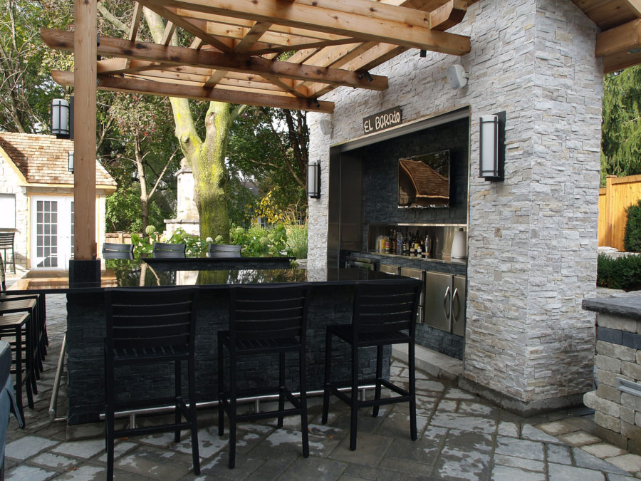 modern outdoor bar design with stone 900x675 20 Modern Outdoor Bar Ideas To Entertain With!