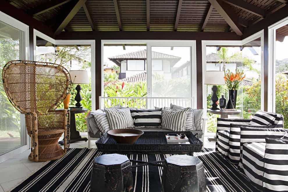 indoor-sunroom-furniture-Sunroom-Contemporary-with-area-rug-beachy-cane-chair-corner-windows