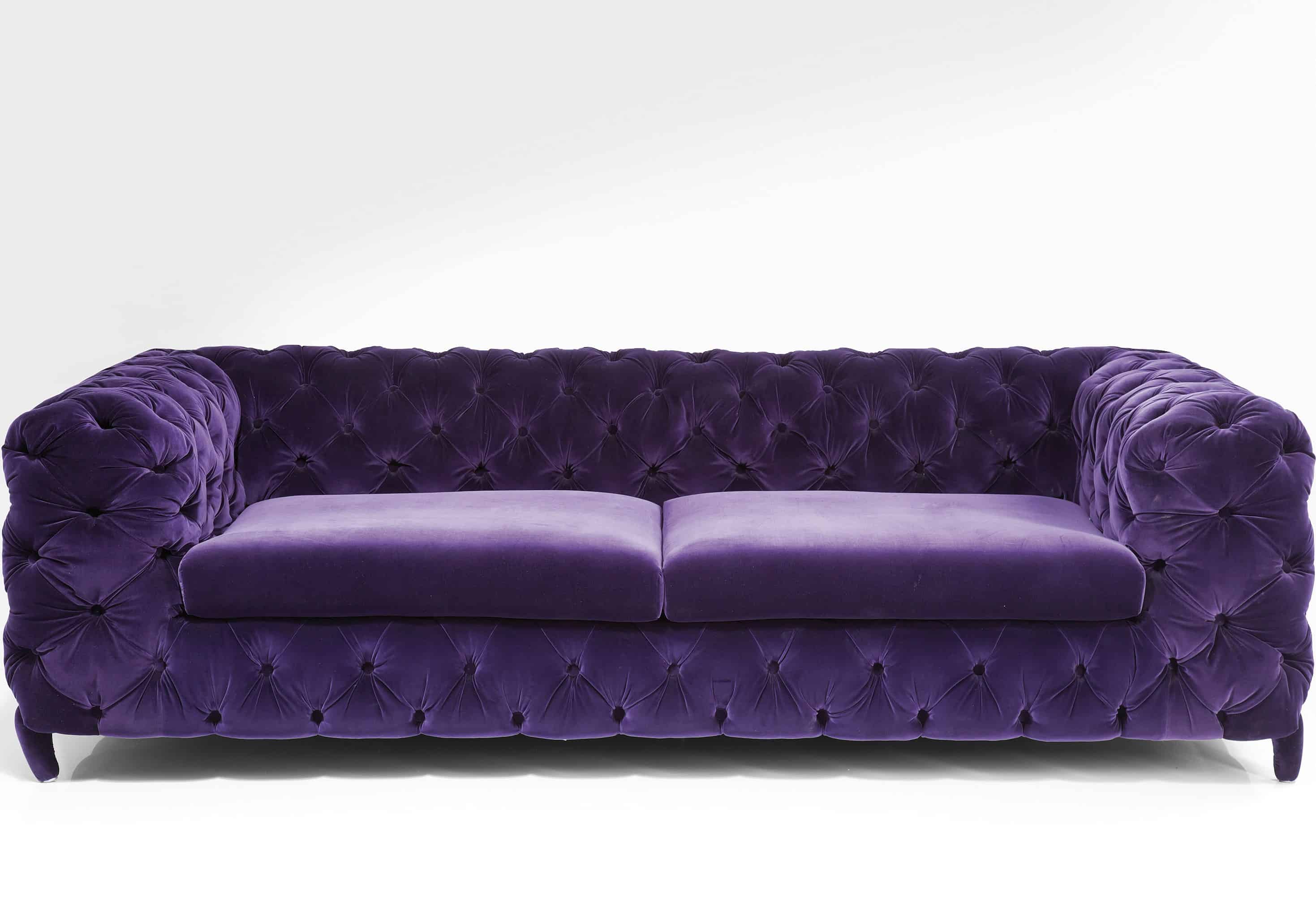 purple velvet tufted sofa