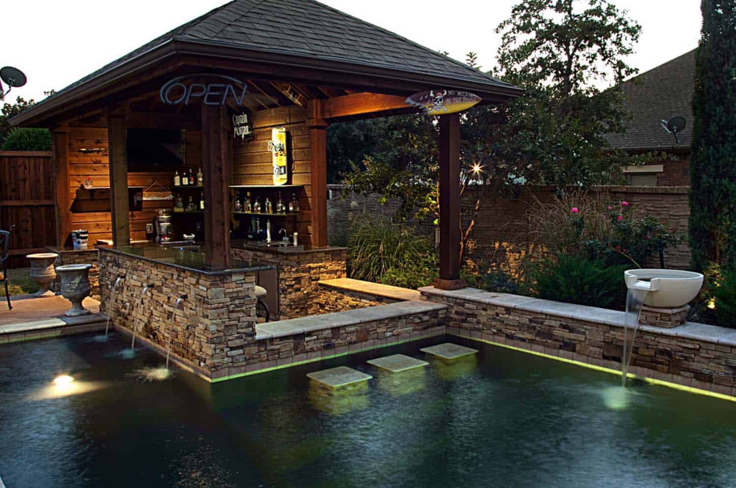 Consider placing your built-in bar coming off directly from your pool in order to create the ultimate staycation feel.