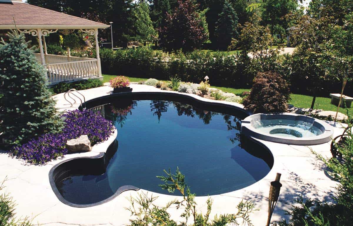Pair your dark blue pool with rich tones around it for an even grander vacation effect in your backyard space