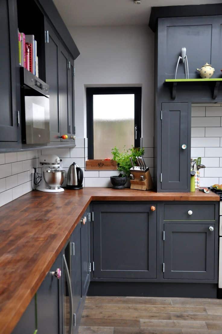 dark charcoal cabinets with wooden countertop kitchen