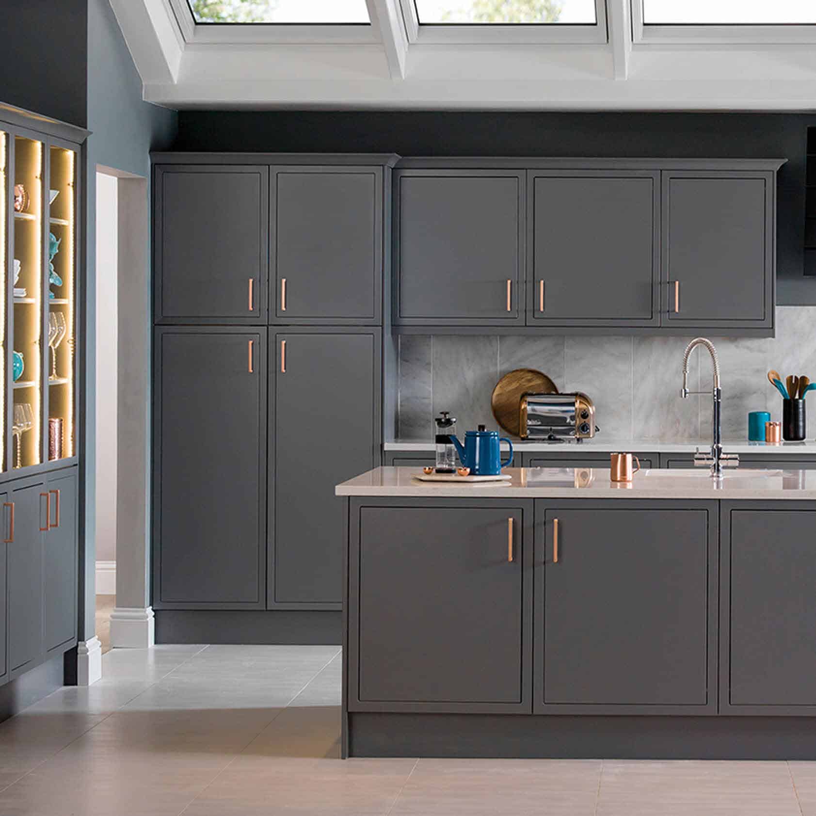 dark grey kitchen with copper handles