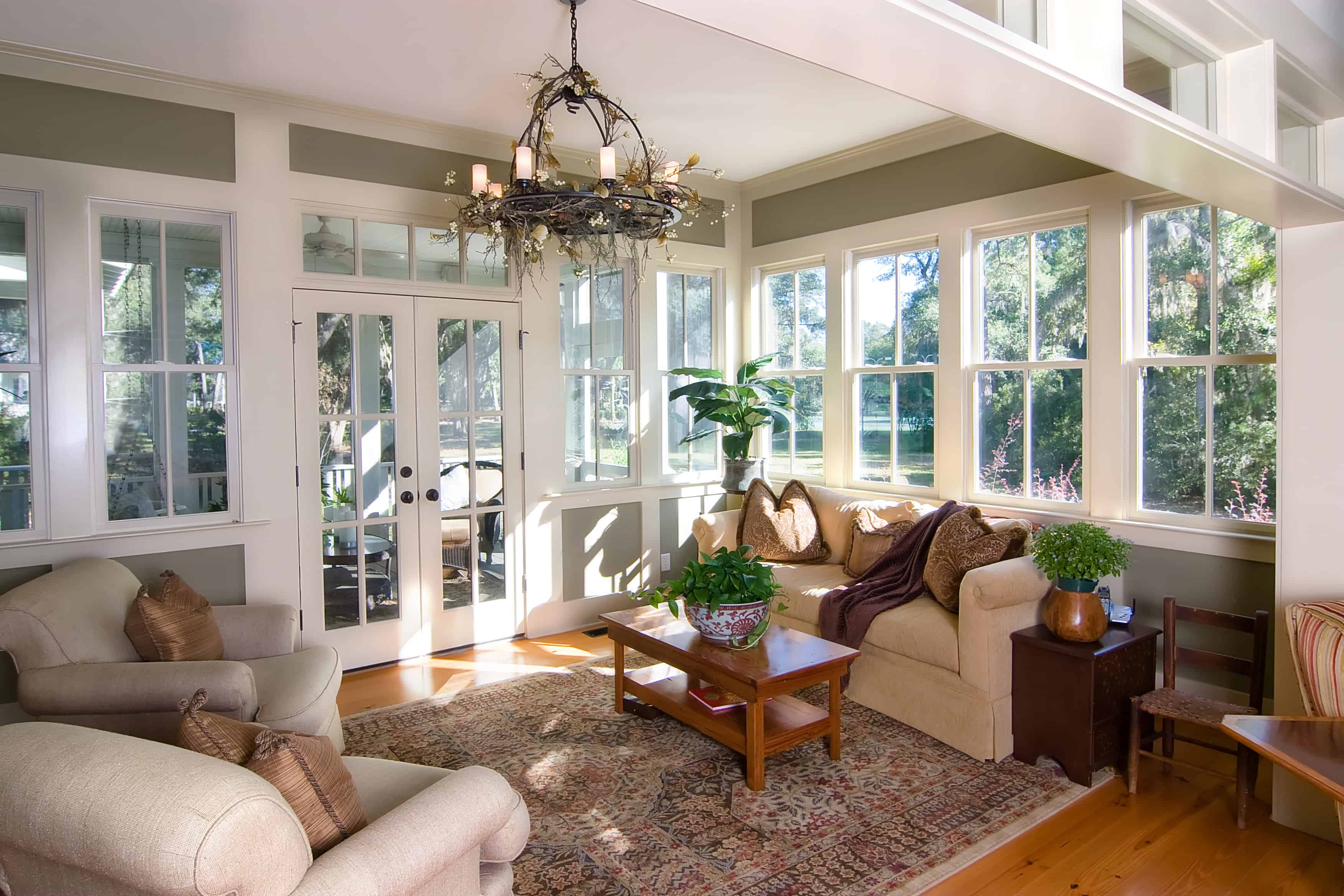 decorated living room with sunroom