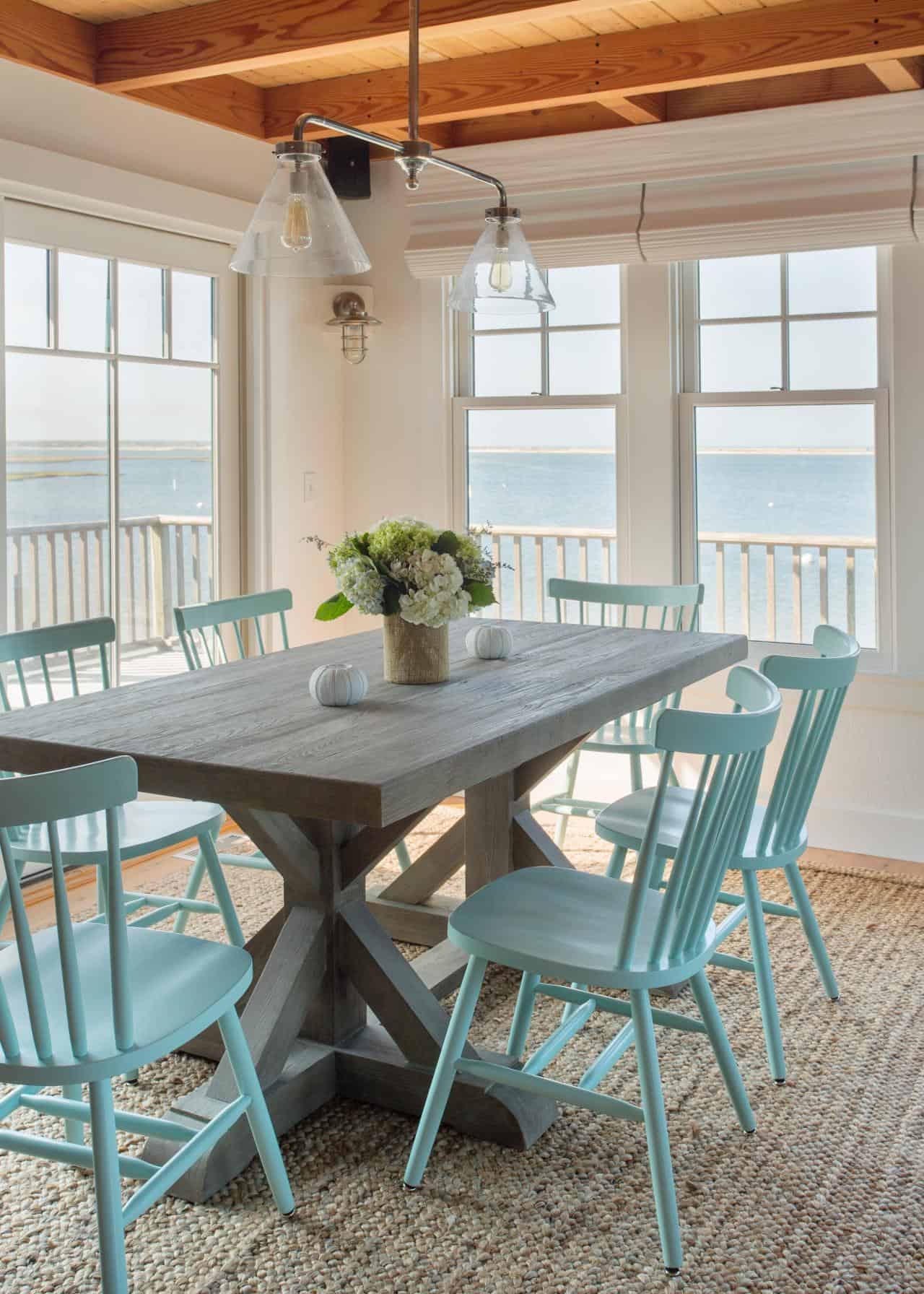 Add blue chairs to your trestle table to create a coastal feel that makes the space seem more space while still providing color