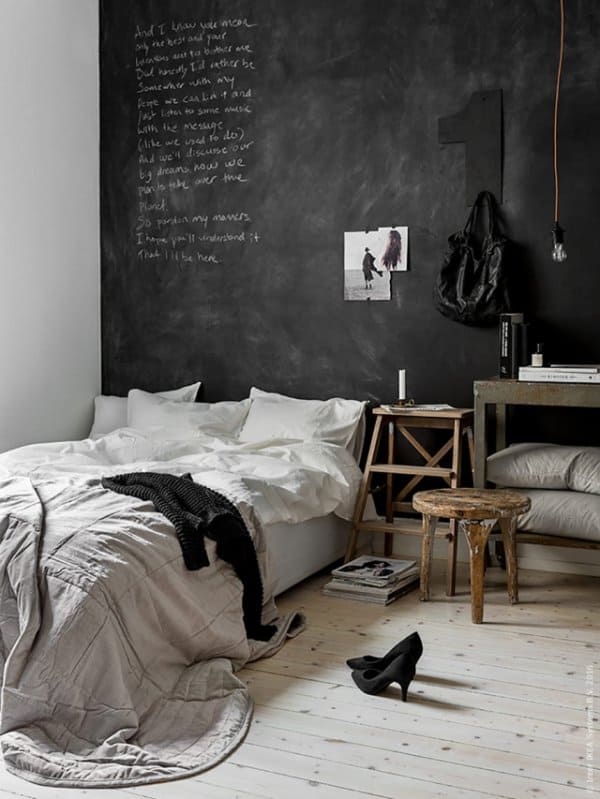 black bedroom with chalkboard wall