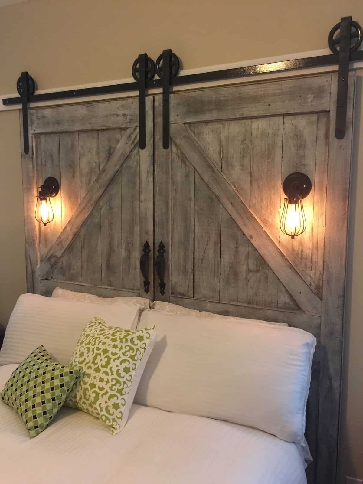 Adding lights to your barn door headboard is an excellent way to customize the bed space.