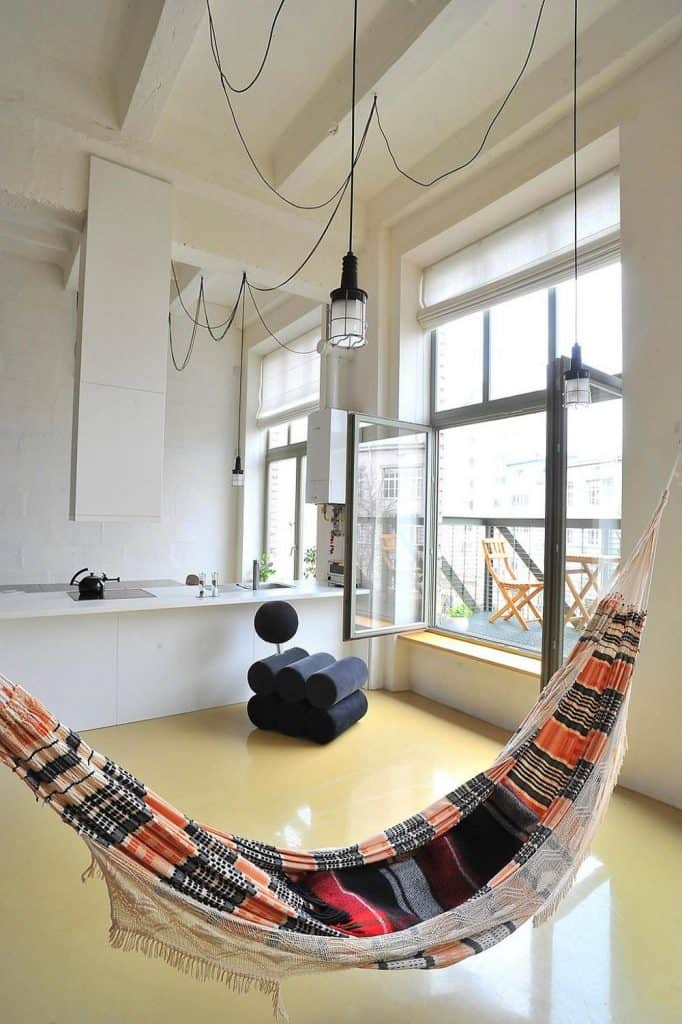 ordinary-strped-pattern-hammock-interior-design-with-small-pendant-lamp-and-unique-chair-beside-white-cabinet-along-with-wide-glass-window-682x1024