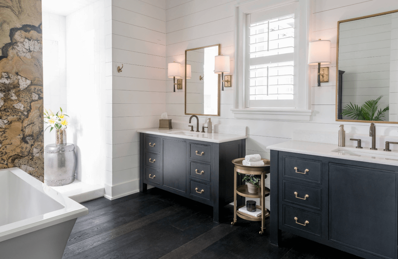 If you don’t want to add all dark hues to your bathroom yet want that bit of richness that is also edgy, add one or two dark vanities.