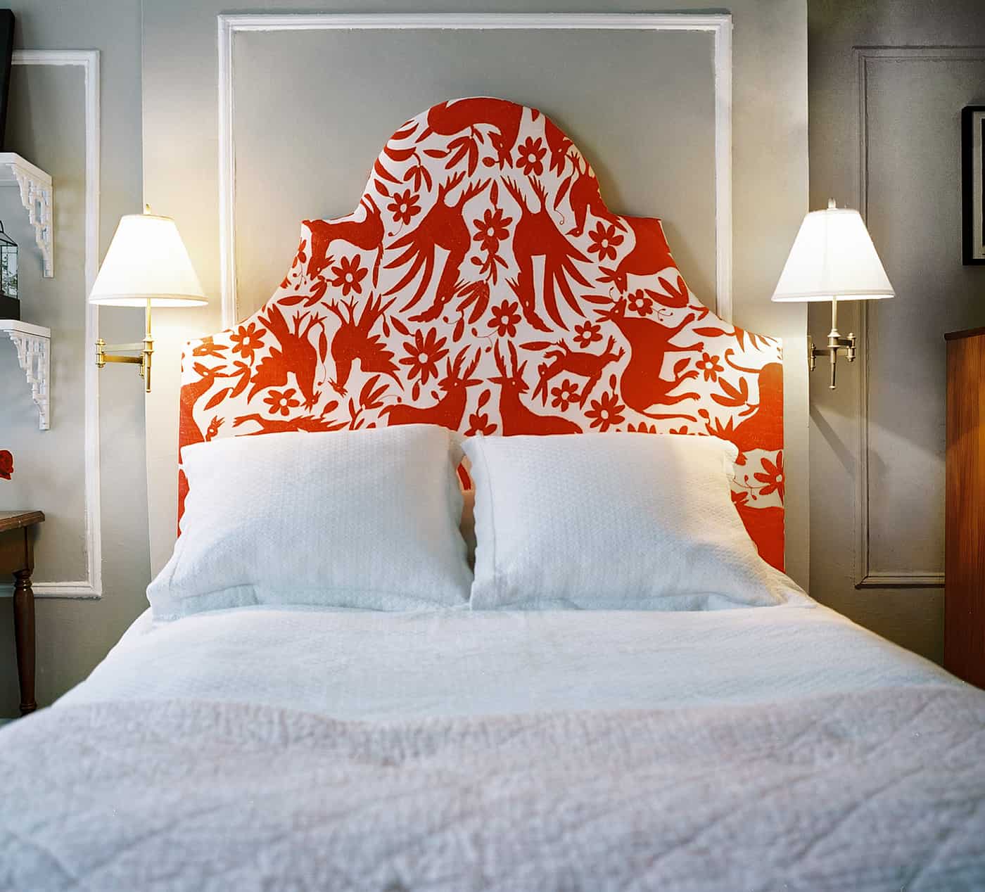 The beauty of having red as part of your headboard is how powerful the color is on its own.
