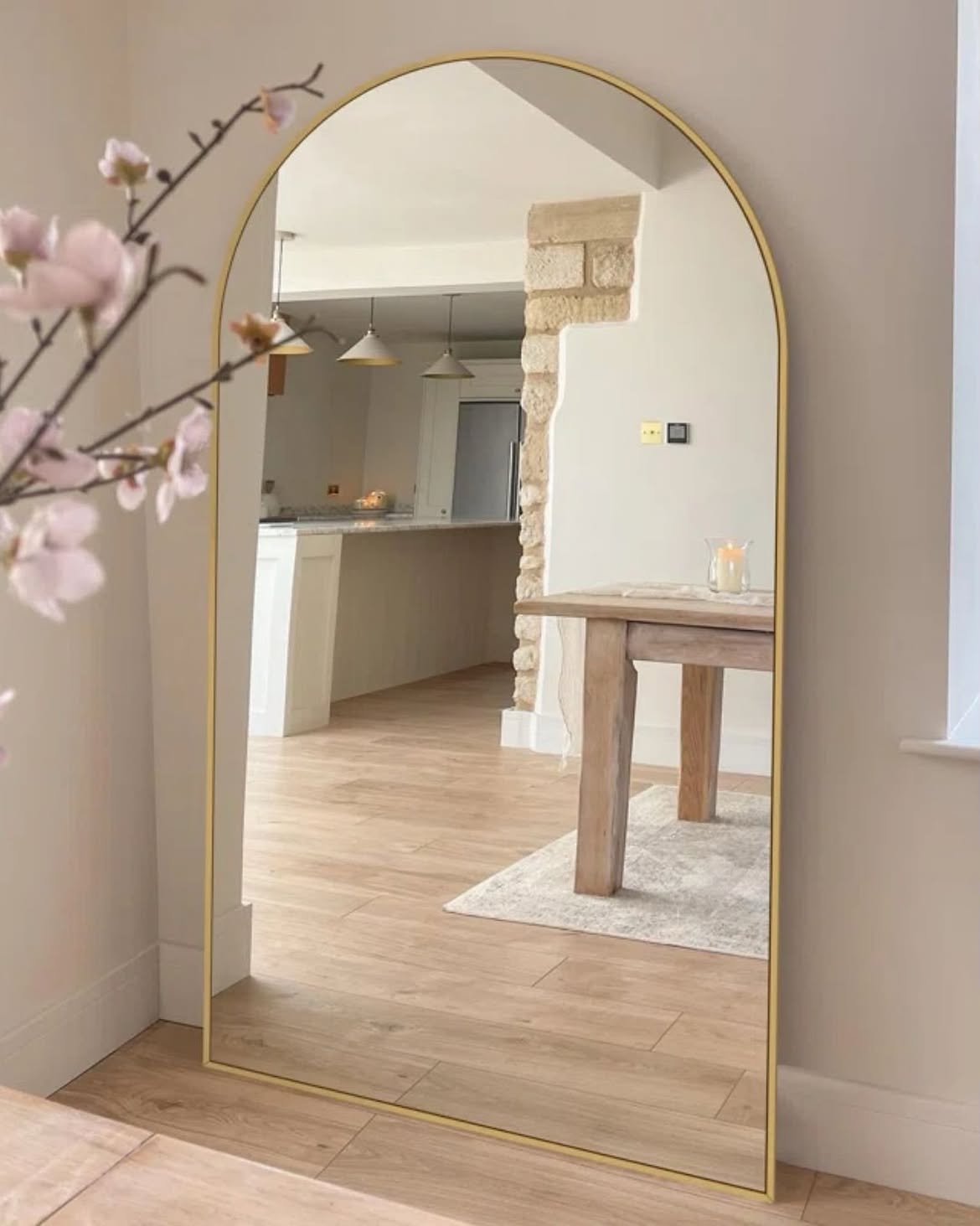 01-arched-gold-floor-mirror-dining-nook-magnolia-branches