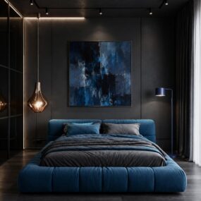 A blue tufted platform bed against a dark gray wall with large blue abstract art, copper pendant, and cobalt floor lamp.