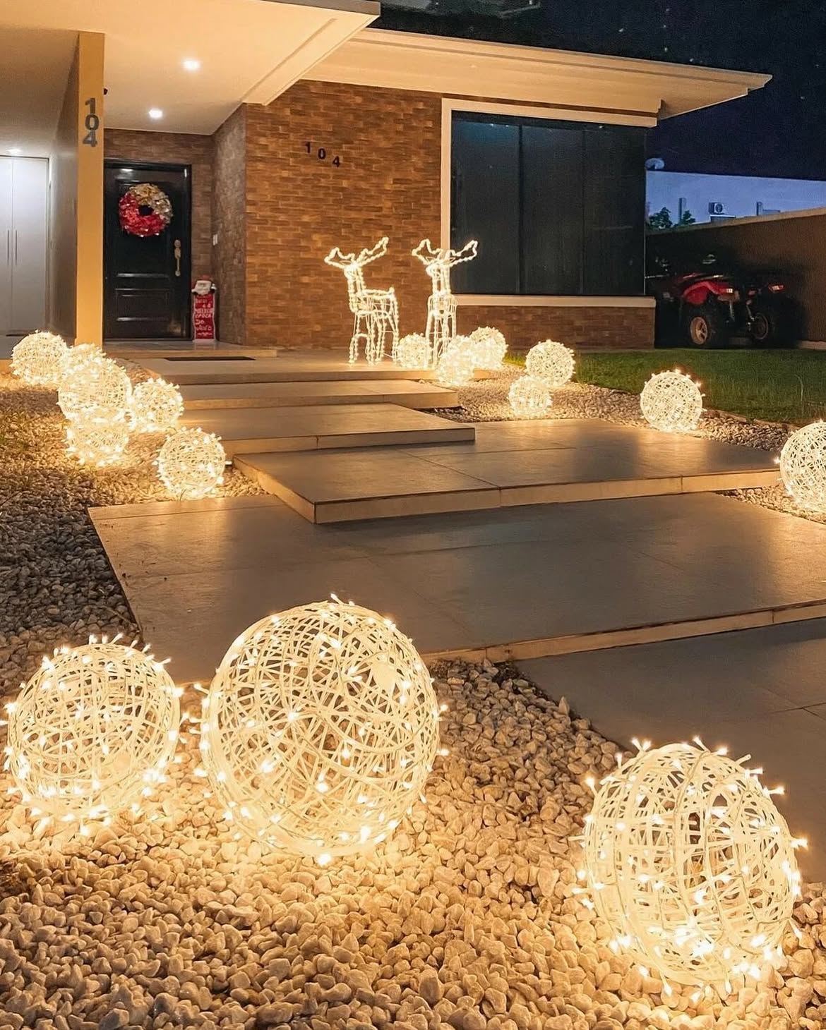 02-lit-rattan-globes-lining-front-walk