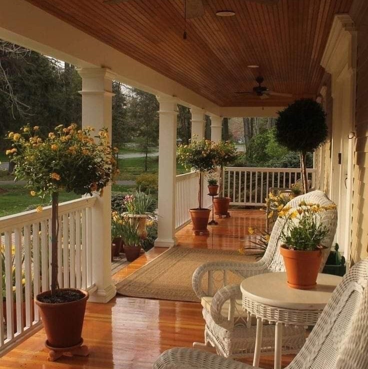 03-long-front-porch-topiaries-terracotta-pots
