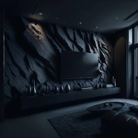 A moody living room with a sculptural black rock-textured feature wall, mounted TV, floating console with ceramic vases, and black sectional.