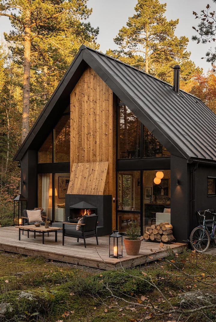 05-black-scandinavian-cabin-wood-chimney-outdoor-fireplace-deck