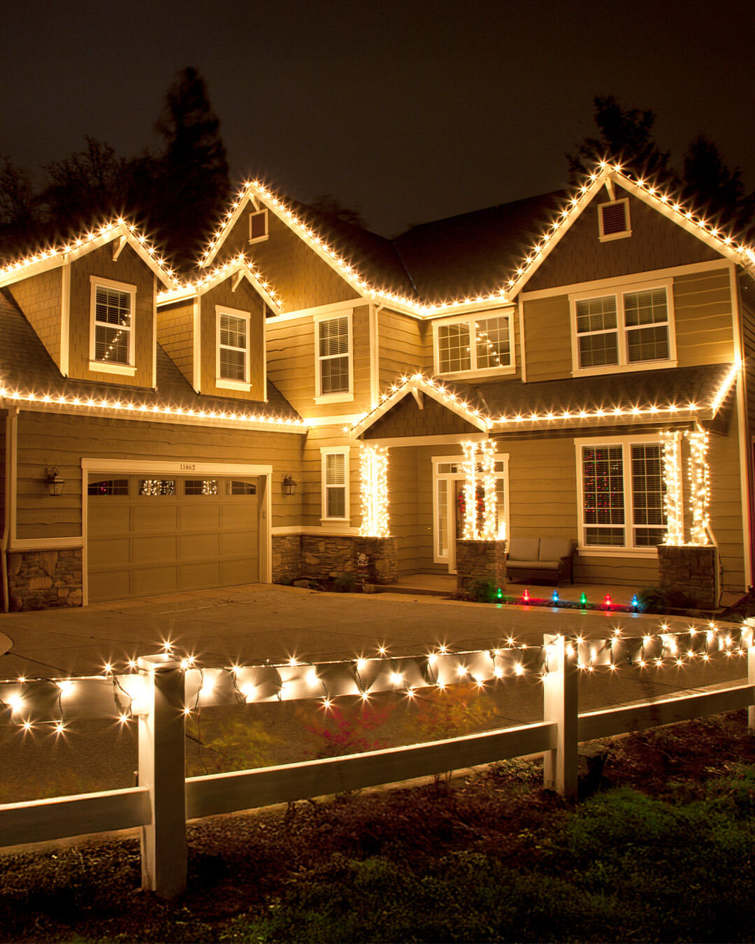 05-full-roofline-and-fence-wrapped-in-warm-whites
