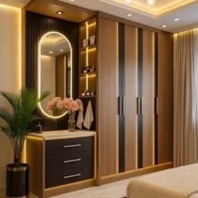 A built-in wood and black wardrobe with an attached vanity, arched LED mirror, lit shelving, and a gold sputnik chandelier in a bedroom.