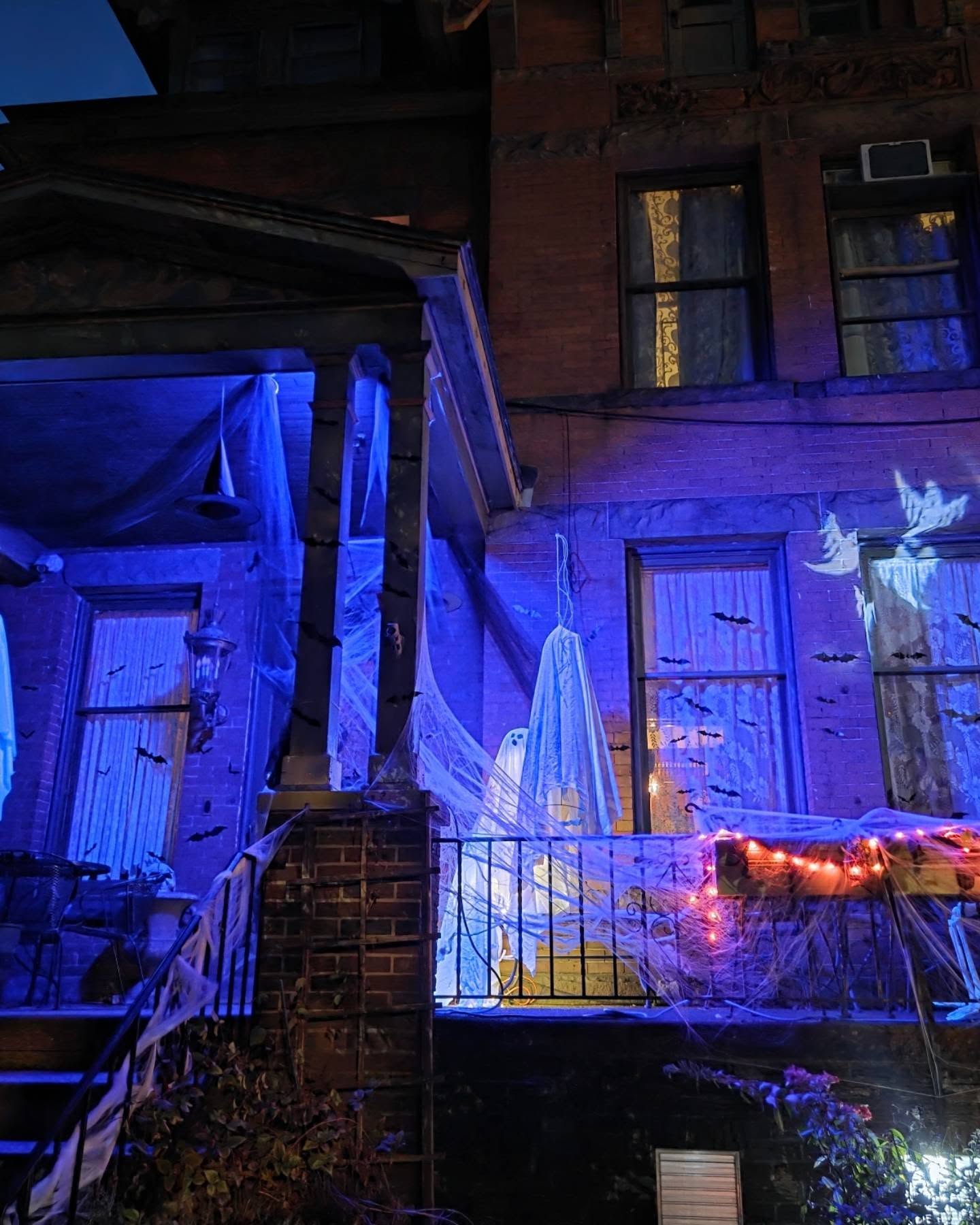 1-blue-washed-brownstone-porch-hanging-ghosts