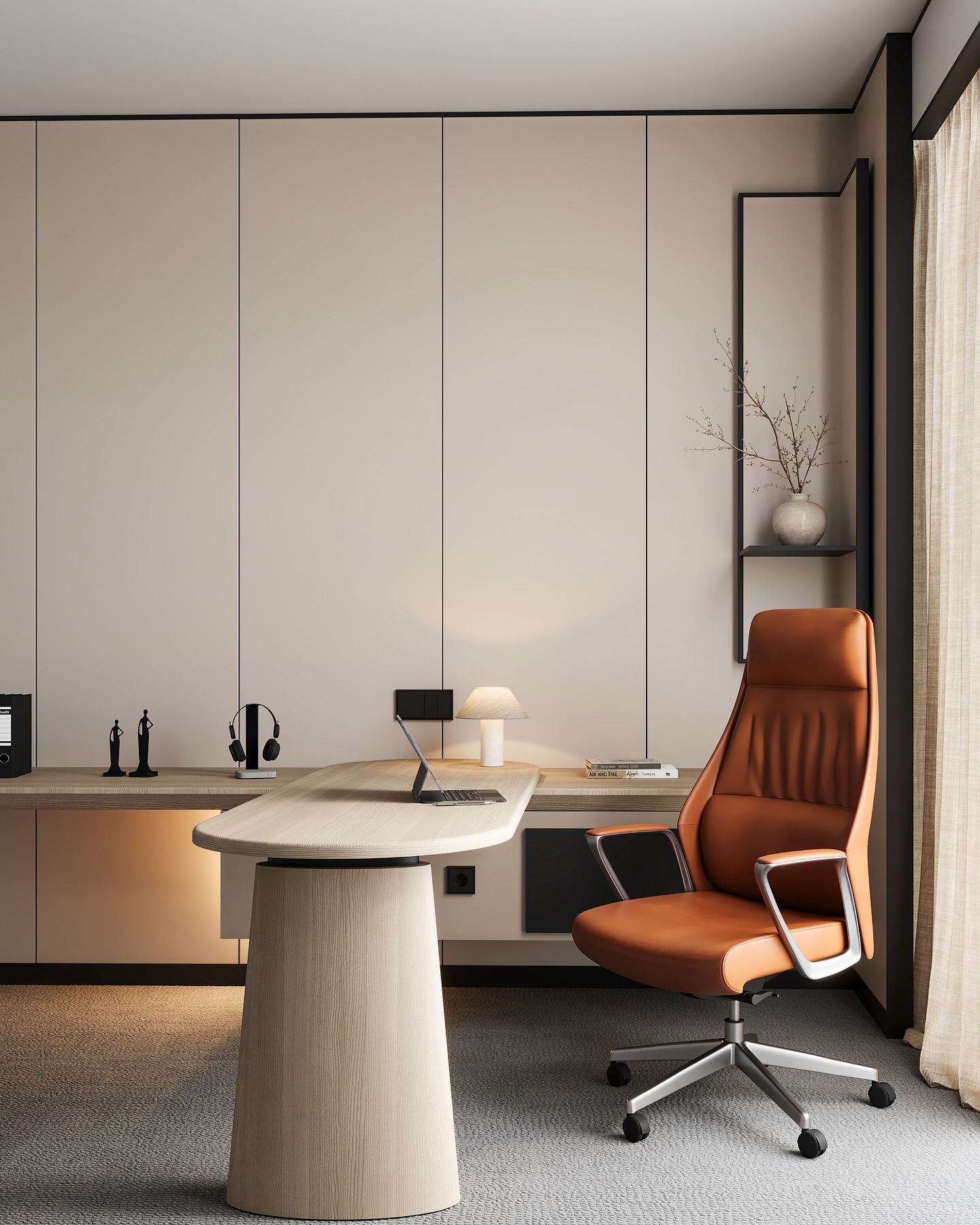A minimalist home office with beige paneled walls, a light wood pedestal desk, orange leather high-back executive chair, laptop, small table lamp, and a vase of dried branches on a floating shelf.