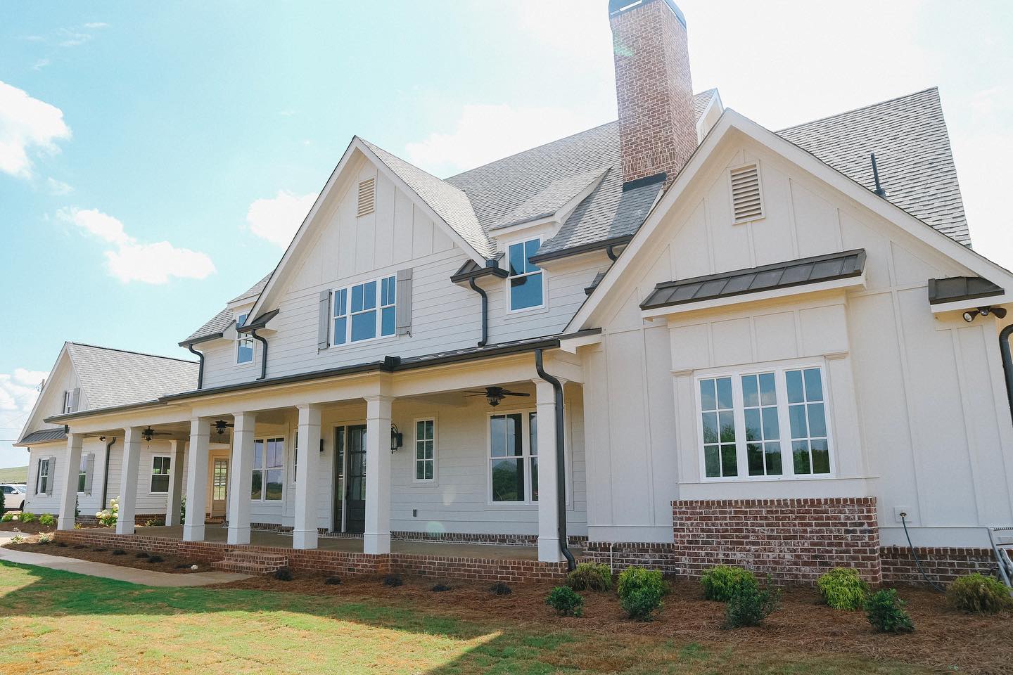 classic-white-farmhouse-dark-metal-accents-exterior-crowebuilt