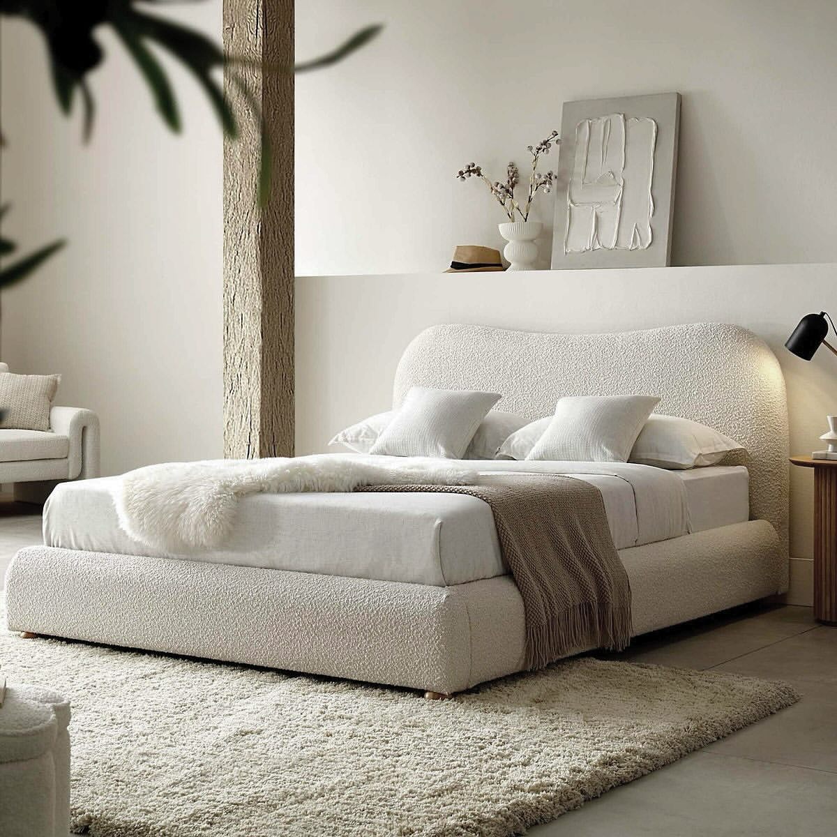 curved-boucle-platform-bed-in-minimalist-room