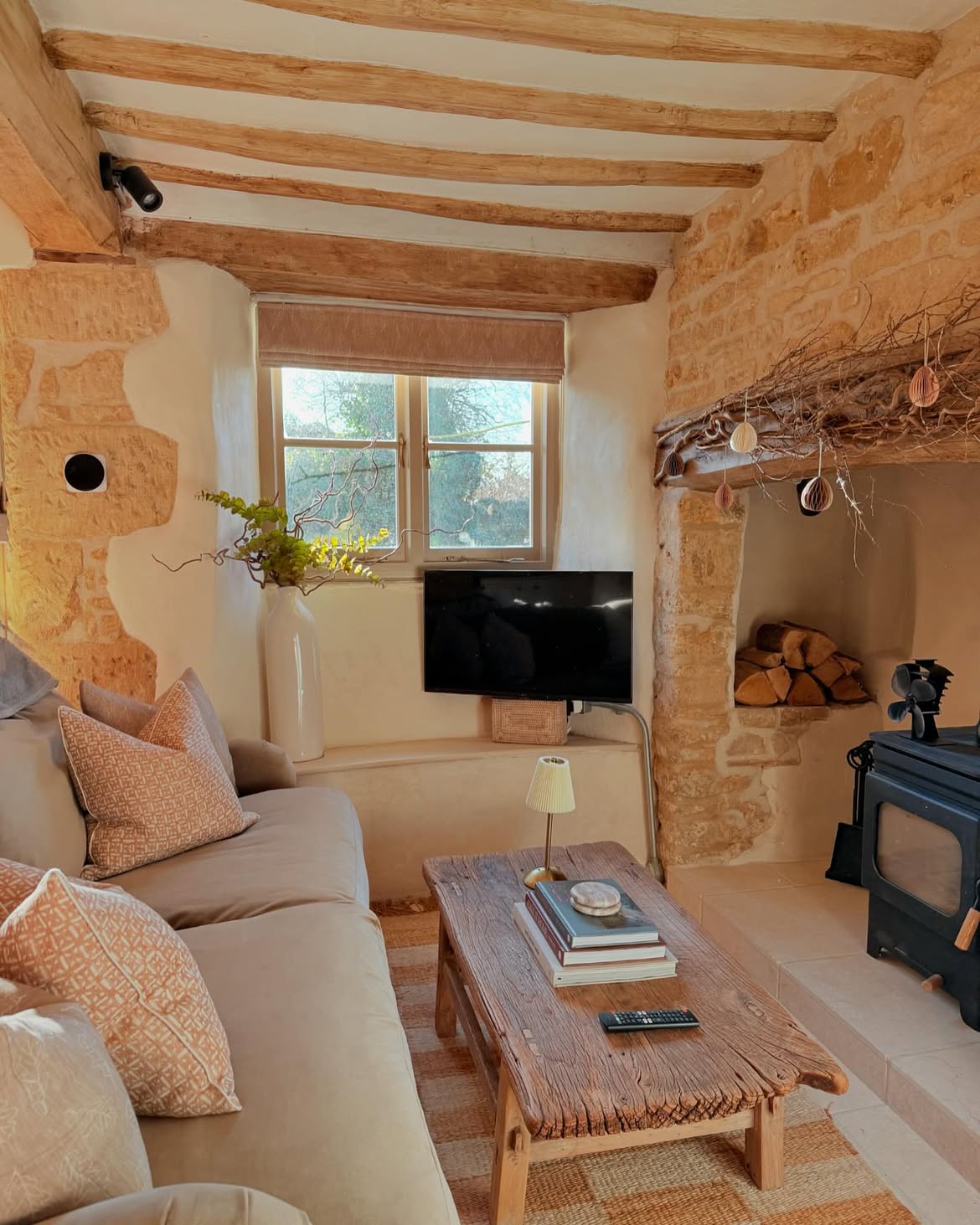 limewashed-stone-cottage-wood-stove-living-room