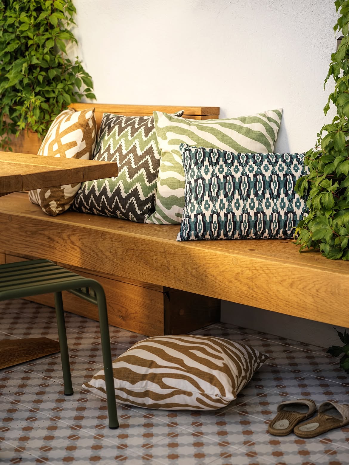 mixed-geometric-chevron-ikat-zebra-cushions-wood-bench-ivy-tile-floor