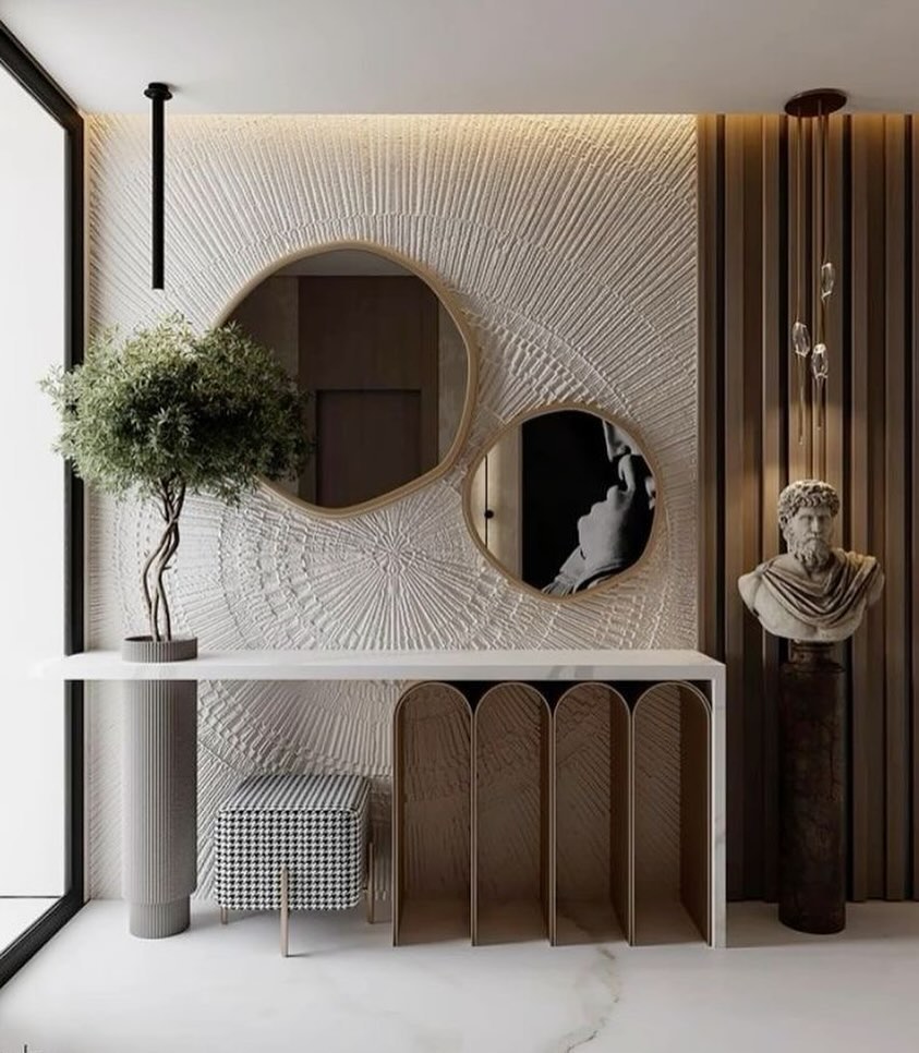 overlapping-round-mirrors-textured-wall-foyer