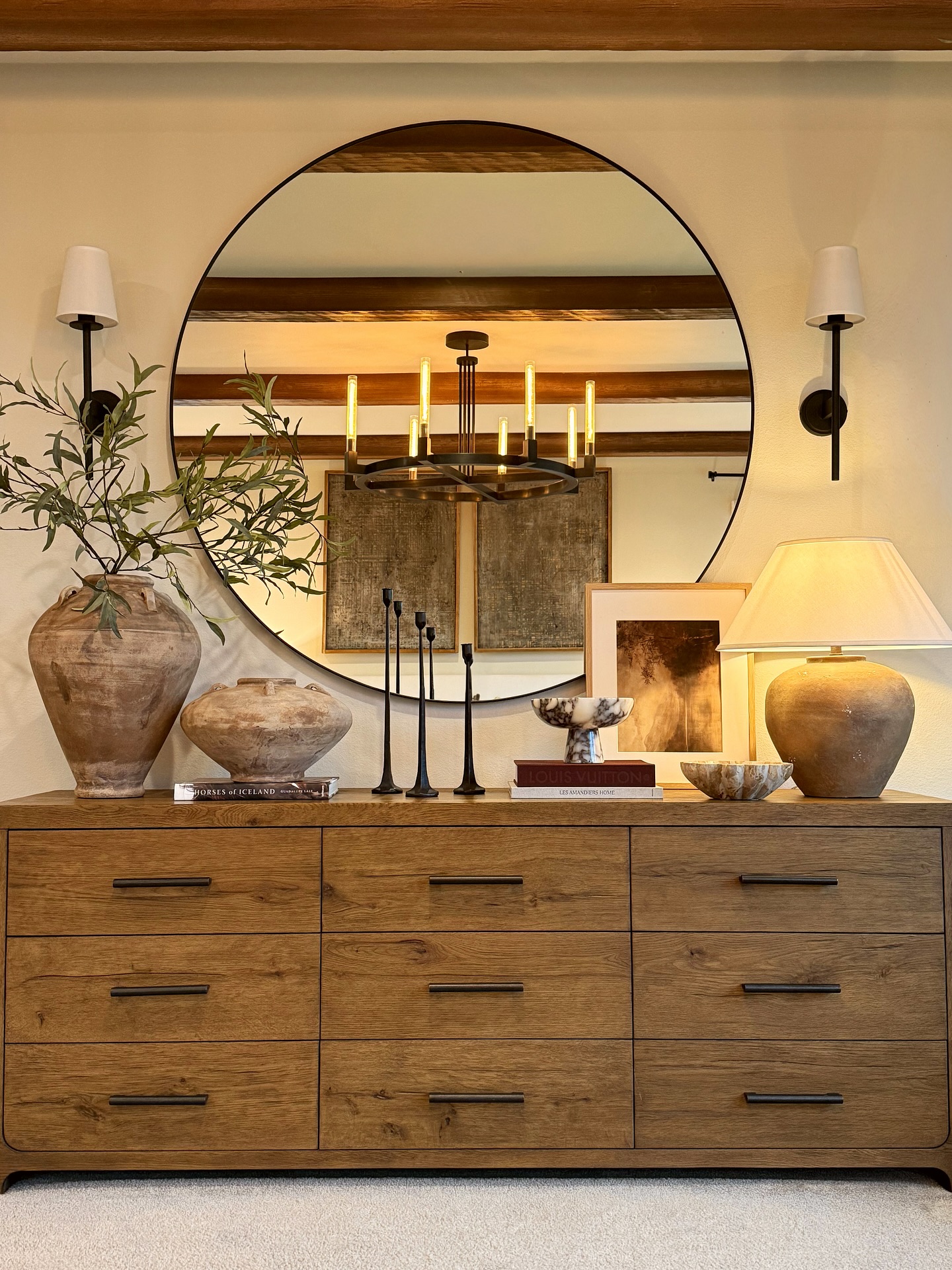round-mirror-layered-vases-art-dresser-decor