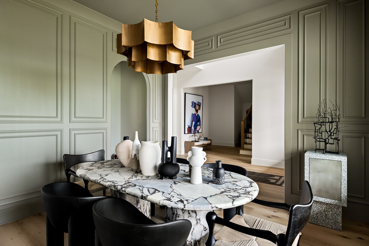 sage-green-paneled-dining-room-with-marble-table-studioladner