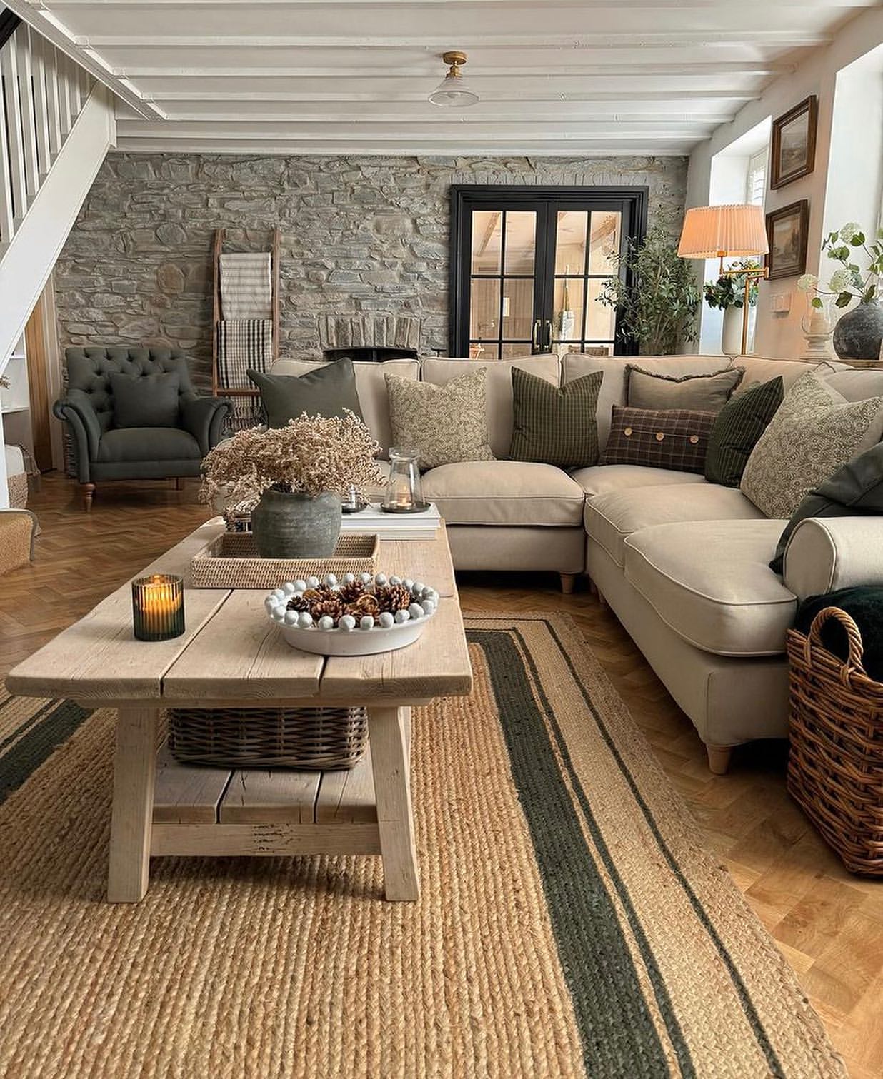 stone-wall-snug-striped-jute-rug-cottage-living-room