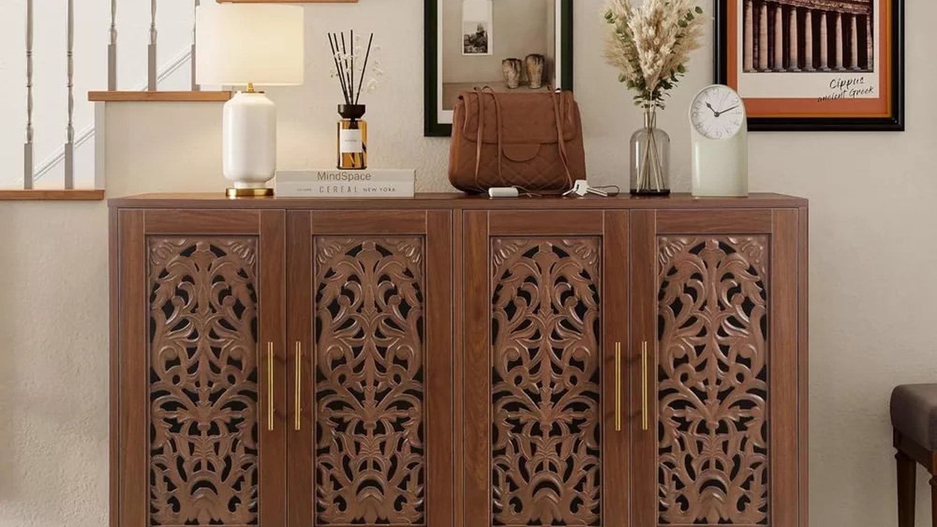 walnut-entryway-cabinet-carved-fretwork-door-panels-brass-pulls