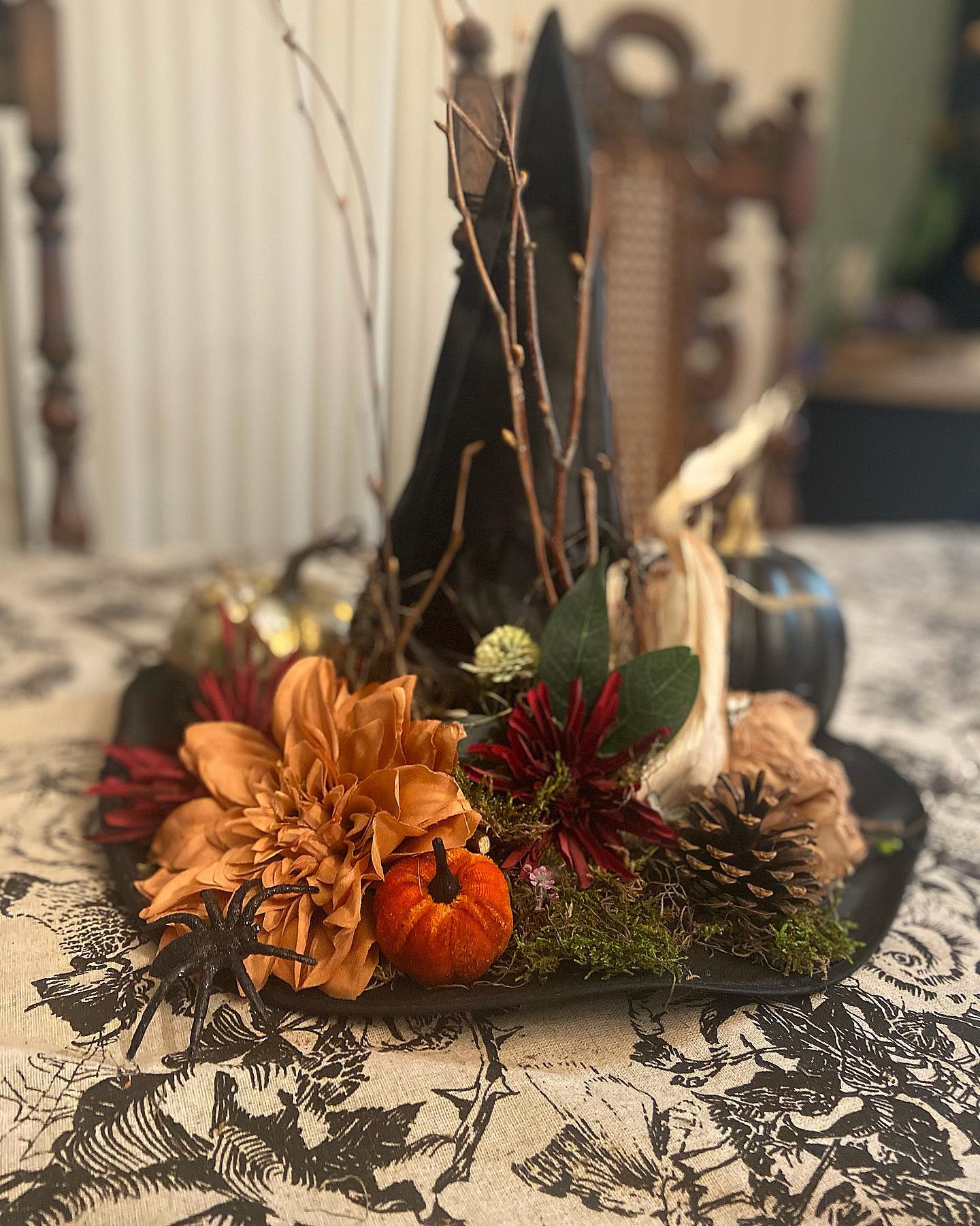 witch-hat-with-twigs-dahlias-and-moss-base