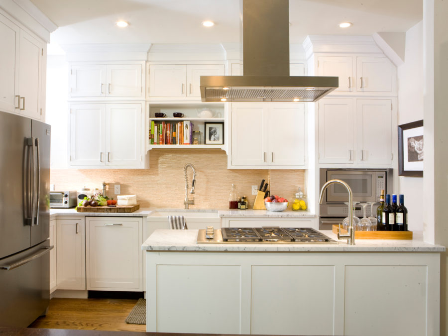 As seen on HGTV's Kitchen Cousins, the Pino's kitchen with new white kitchen cabinets.