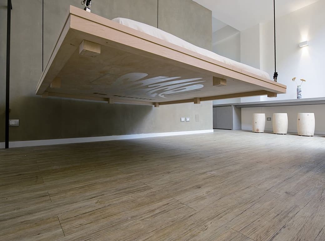space saving bed raises become ceiling art renato arrigo 2