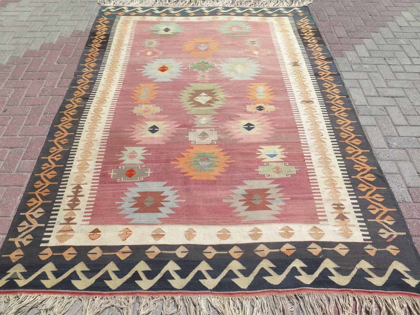 turkish-kilim-wool-area-rug-black-border-pastel-colors.jpg