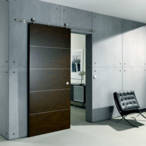Contemporary Sliding Door from Bartels – an exposed stainless steel rail system