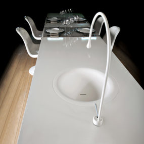 Goccia Kitchen Faucet by Gessi is built into the dining table