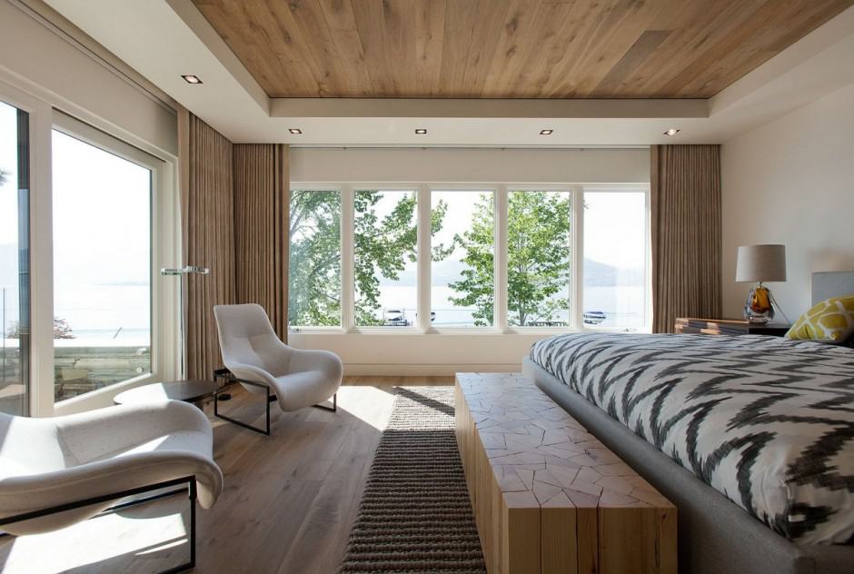 lakeside vacation home combines natural materials modern living 21 master bedroom 2