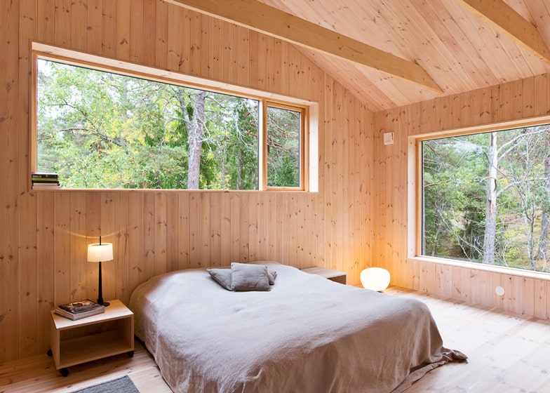 single storey summer house overlooks forested gorge sweden 10 master bedroom