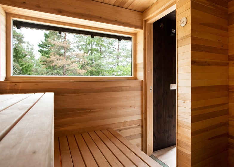 single storey summer house overlooks forested gorge sweden 8 sauna