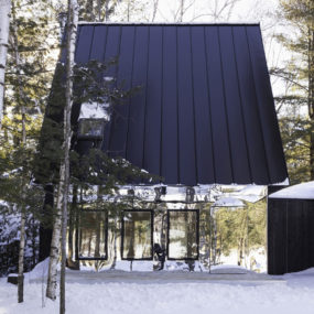 Mountain Cabin in Ontario Reflects Lakeside View with Mirrored Facade