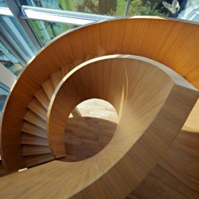 Concrete Circular Stairwell Focus of Minimalist Residence
