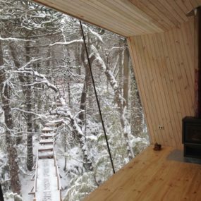 Winter Cabin Accessed by Elevated Walkway