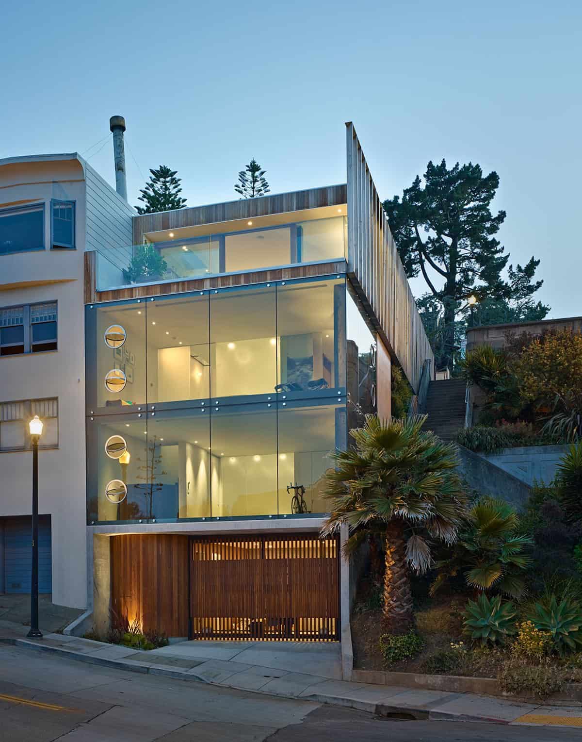 Garage and 3rd Floor Deck connects Glass Home to Slope