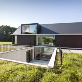 Modern Barn Style Home Showcases Glazings and Below Grade Ramp