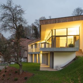 3 Storey Home on Steep Slope with Grass Roofed Garage