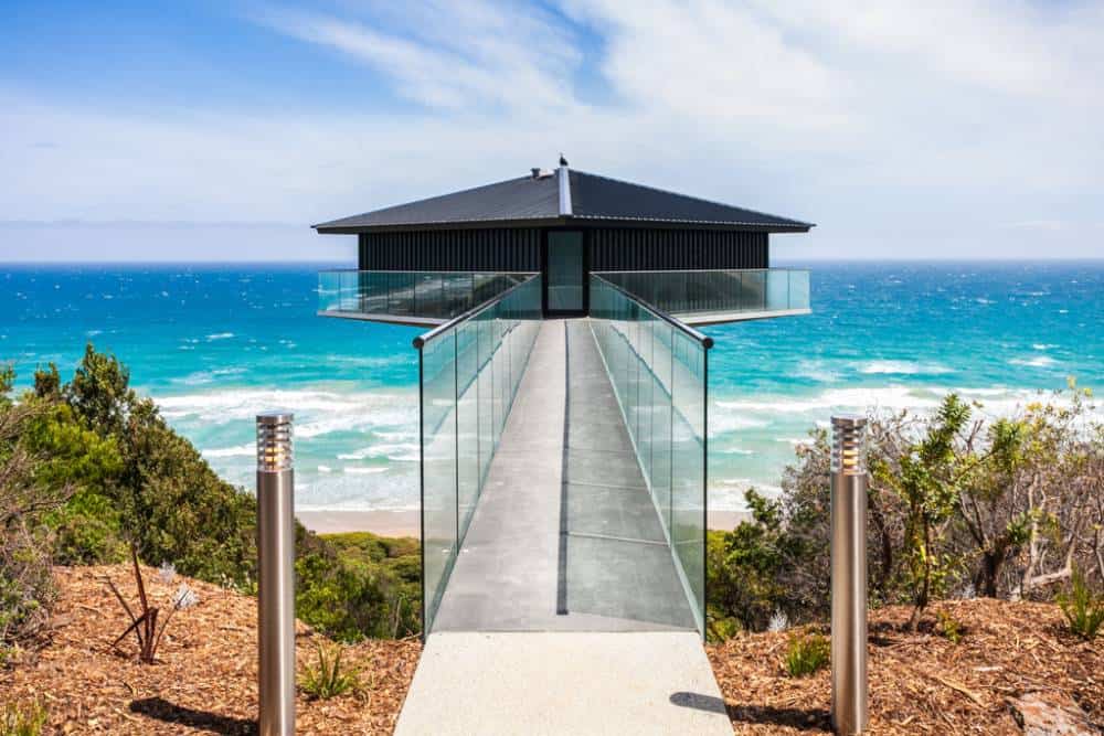 House Perched on Central Column Overlooks Ocean on 3 Sides