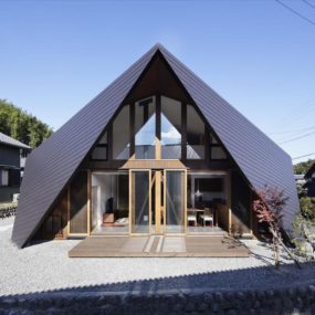 Home Surrounded by Rock Wall and Protected by Folded Roof